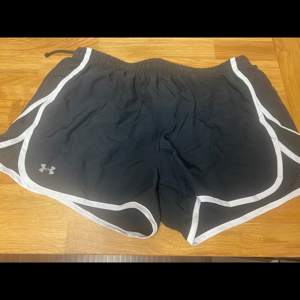 Under Armor black and white running shorts.